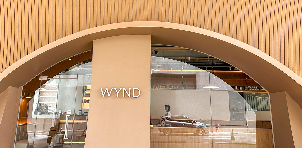 Wynd cafe in Thong Lor Bangkok with a wooden arch ceiling and minimalist muted-tone interior
